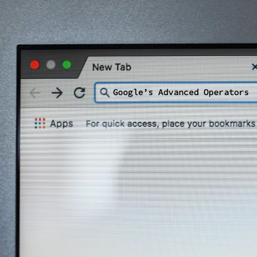Computer monitor with Google search bar demonstrating a search query for advanced search operators