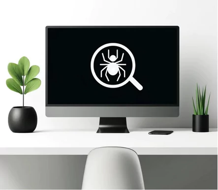 A minimalist workspace scene with a white background, showing a modern, black monitor screen displaying a simple graphic of a spider and a magnifying glass, with a green potted plant to the side.